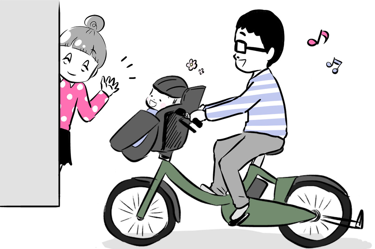 パパと一緒に自転車に乗っている